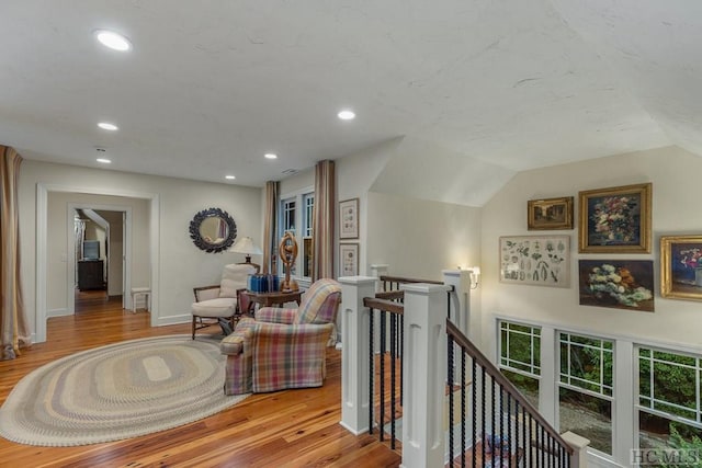 interior space featuring light hardwood / wood-style floors and lofted ceiling