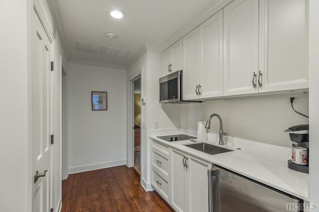 kitchen featuring white cabinetry, sink, dark hardwood / wood-style floors, fridge, and black electric cooktop