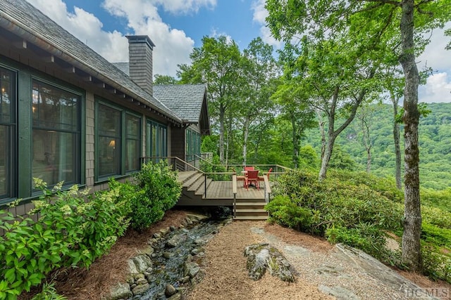 view of yard featuring a wooden deck