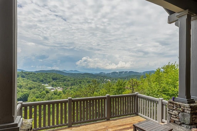 wooden deck featuring a mountain view