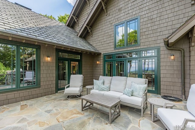 view of patio featuring an outdoor living space and french doors