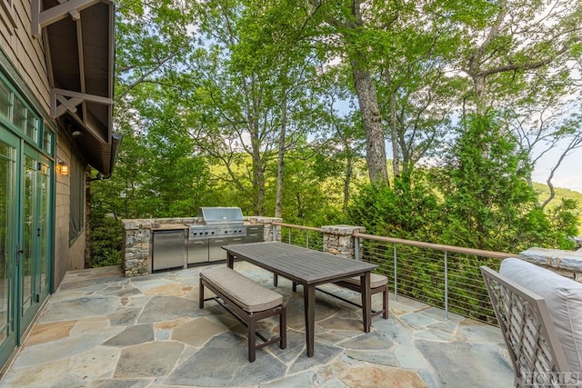 view of patio with exterior kitchen and grilling area