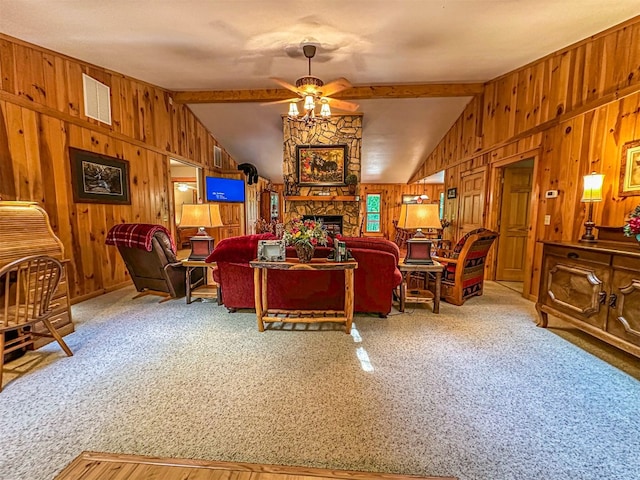 carpeted living room featuring a ceiling fan, lofted ceiling with beams, and wood walls