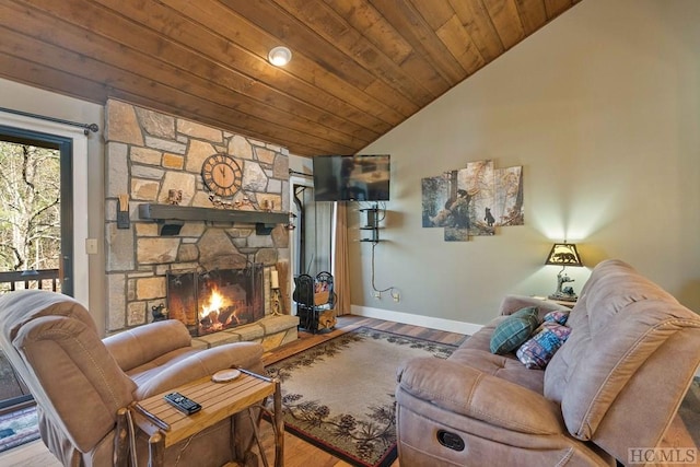 living room with hardwood / wood-style flooring, vaulted ceiling, wood ceiling, and a fireplace