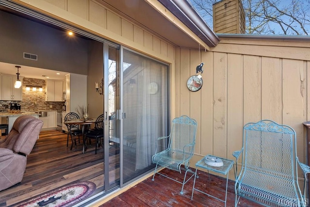 doorway to property with a wooden deck