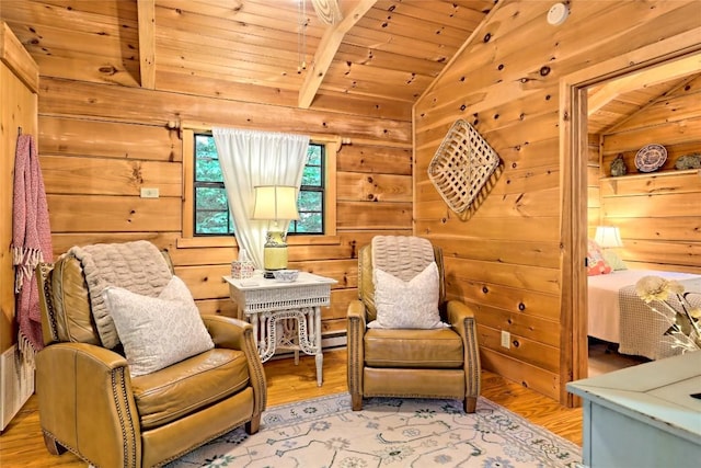 living area with lofted ceiling, wood walls, wood ceiling, and light hardwood / wood-style floors