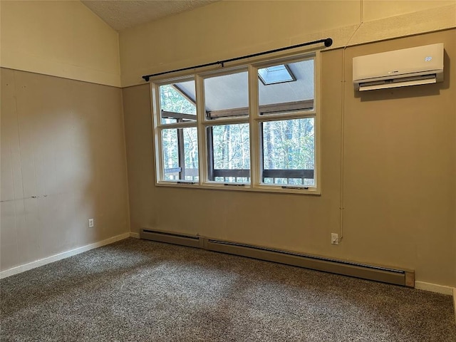 spare room featuring a baseboard radiator, carpet, a wall mounted AC, and a textured ceiling