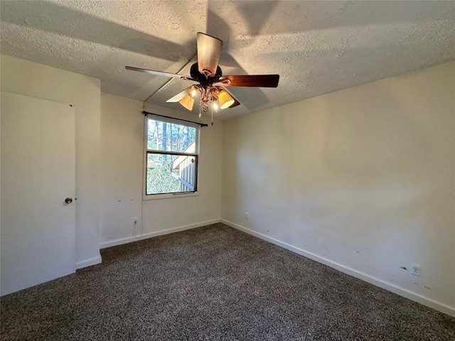 unfurnished room featuring ceiling fan, a textured ceiling, and dark colored carpet