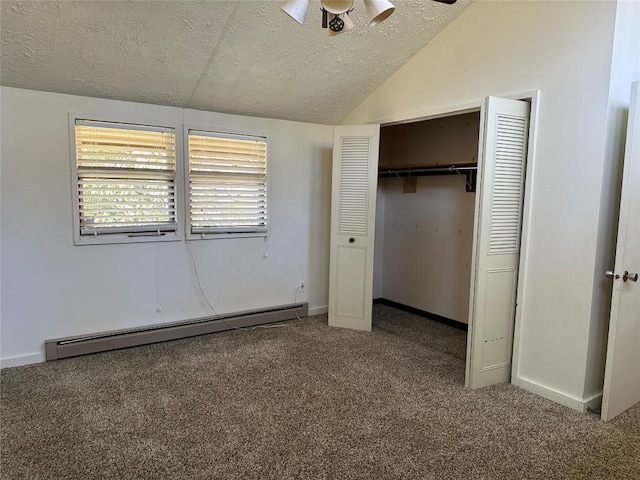 unfurnished bedroom featuring lofted ceiling, carpet flooring, a textured ceiling, and a baseboard heating unit