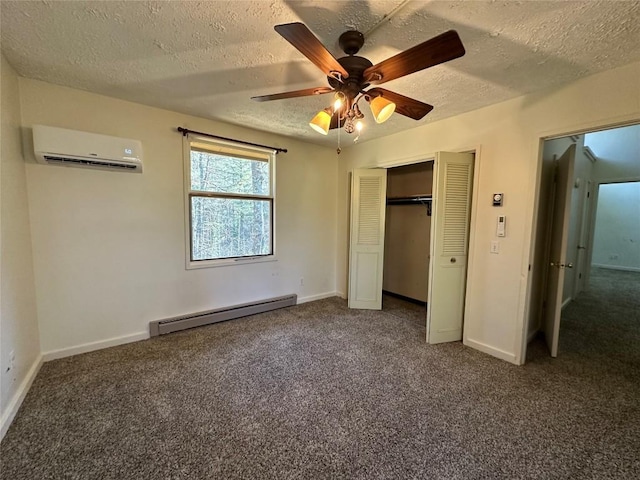 unfurnished bedroom with a closet, a baseboard heating unit, a wall unit AC, and dark carpet