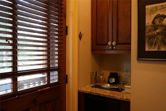 kitchen featuring light stone counters