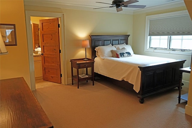 bedroom with light colored carpet, connected bathroom, crown molding, and ceiling fan