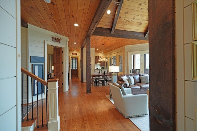 living room with wood ceiling, light wood finished floors, a chandelier, recessed lighting, and stairway