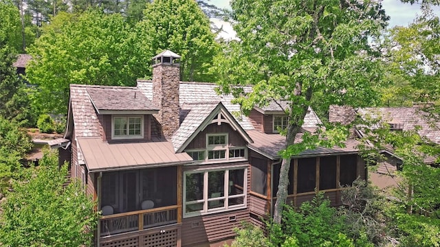 42 Hemlock Rdg, Highlands, NC 28741 - back of property with a sunroom, a chimney, a standing seam roof, and metal roof