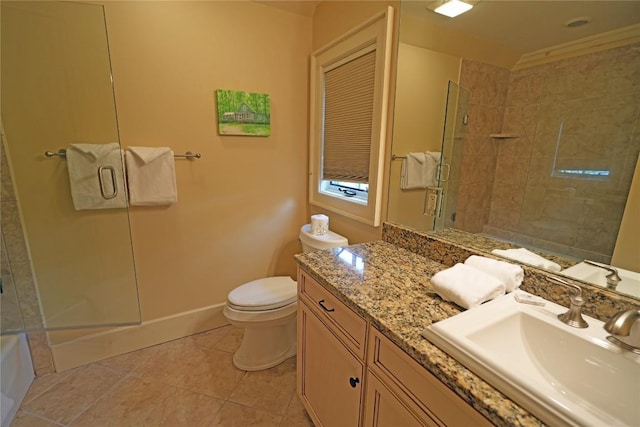 full bath featuring tiled shower, tile patterned flooring, toilet, and vanity