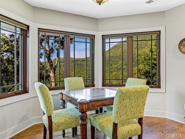 dining area with wood-type flooring