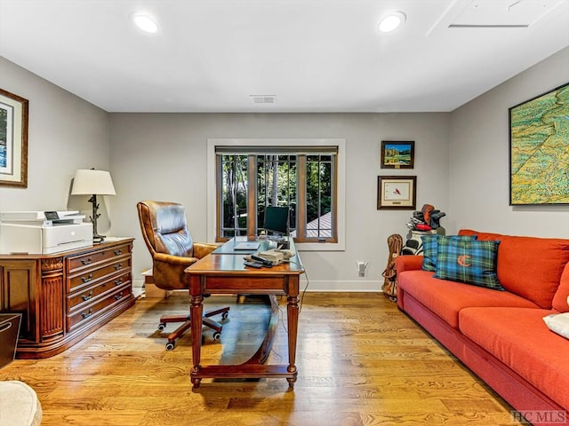 office space with light wood-type flooring