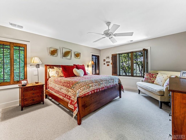 carpeted bedroom with ceiling fan