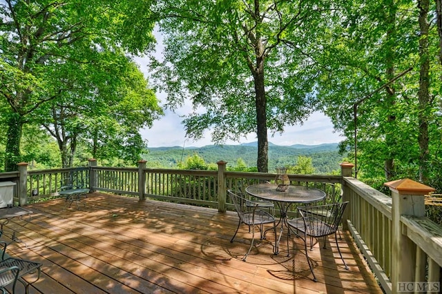 wooden terrace with a mountain view