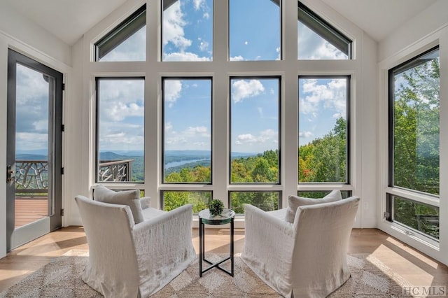 sunroom / solarium with lofted ceiling