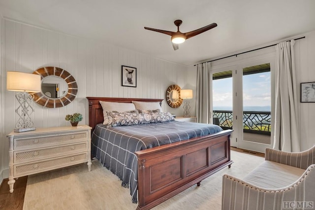 bedroom with ceiling fan, light hardwood / wood-style flooring, and access to outside