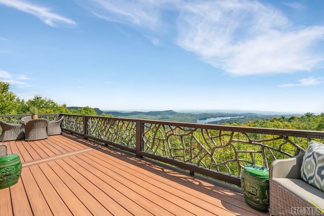 wooden deck featuring a mountain view