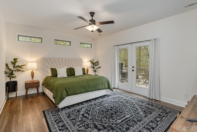 bedroom with hardwood / wood-style floors, access to outside, french doors, and ceiling fan