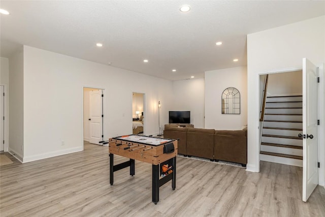 rec room featuring light wood-style floors, recessed lighting, and baseboards