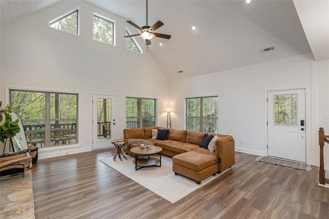 living area featuring high vaulted ceiling, wood finished floors, ceiling fan, and recessed lighting