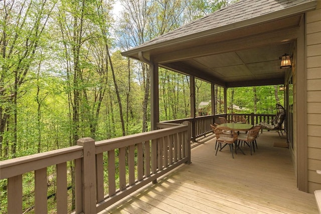 wooden deck with outdoor dining area