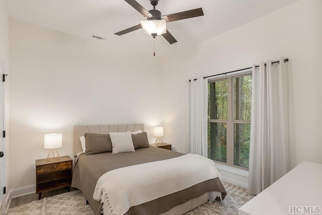 bedroom featuring light wood-type flooring and ceiling fan