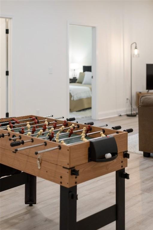 rec room featuring baseboards