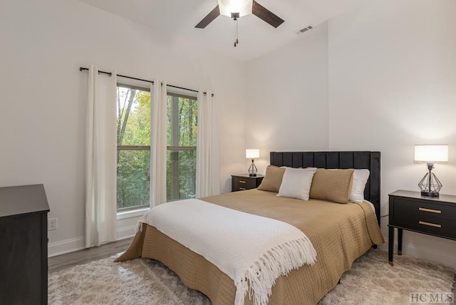 bedroom with ceiling fan and light wood-type flooring