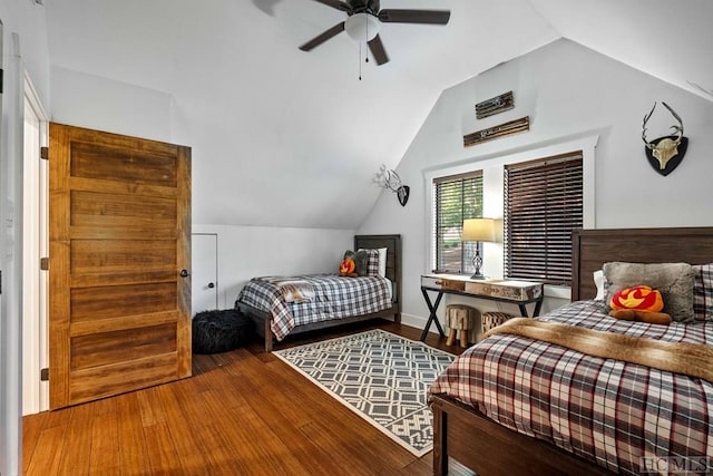 bedroom featuring wood-type flooring, ceiling fan, and vaulted ceiling