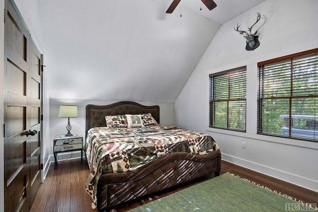 bedroom with ceiling fan, lofted ceiling, and dark hardwood / wood-style flooring