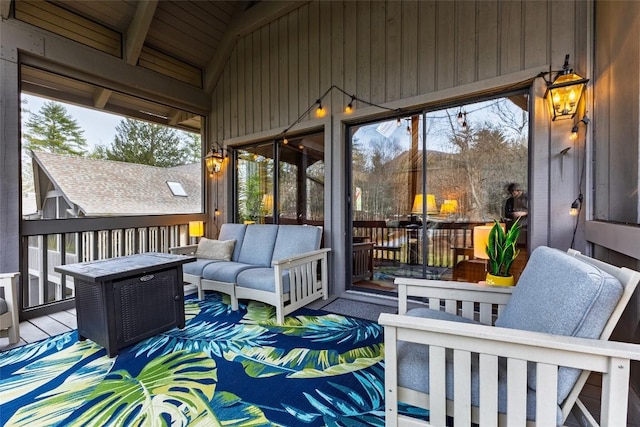 wooden terrace featuring an outdoor living space