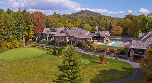 aerial view featuring a view of trees