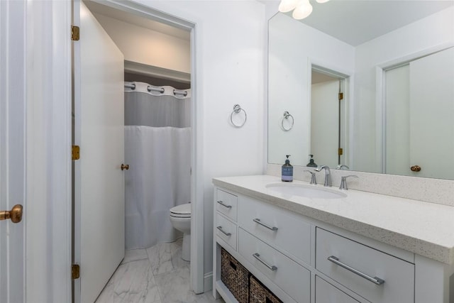 bathroom with marble finish floor, a shower with shower curtain, vanity, and toilet