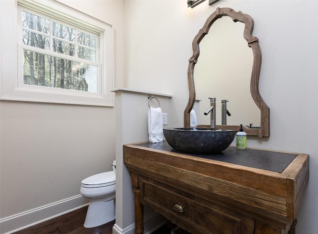 212 Ivorybill Way, Cashiers, NC 28717 - bathroom featuring baseboards, vanity, toilet, and wood finished floors