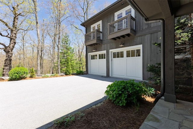 212 Ivorybill Way, Cashiers, NC 28717 - view of property exterior with a garage, concrete driveway, and a balcony