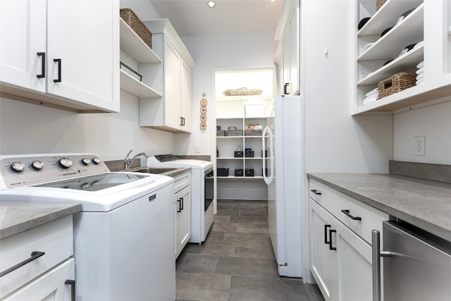 212 Ivorybill Way, Cashiers, NC 28717 - clothes washing area with a sink, cabinet space, and washer and clothes dryer