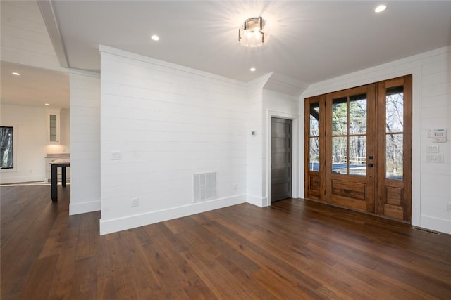 entryway with dark hardwood / wood-style floors