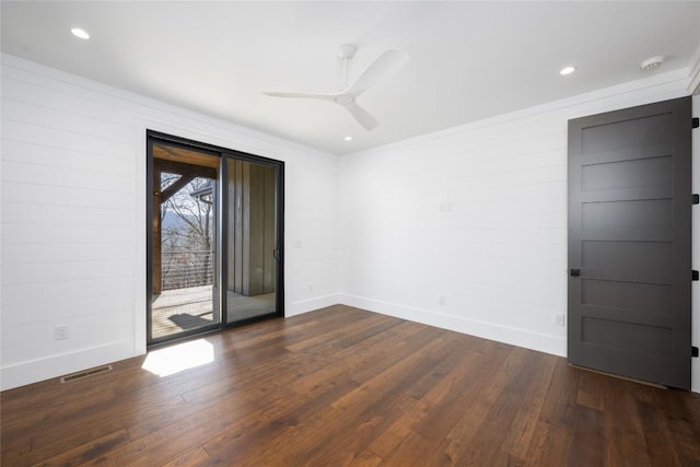 spare room with ceiling fan, ornamental molding, and dark hardwood / wood-style floors