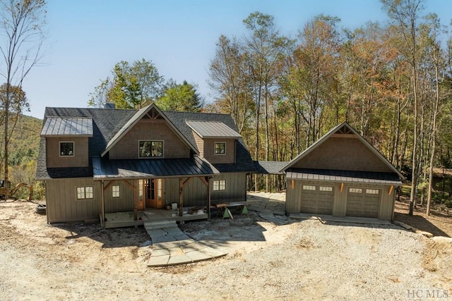 view of front of house featuring a garage and a porch