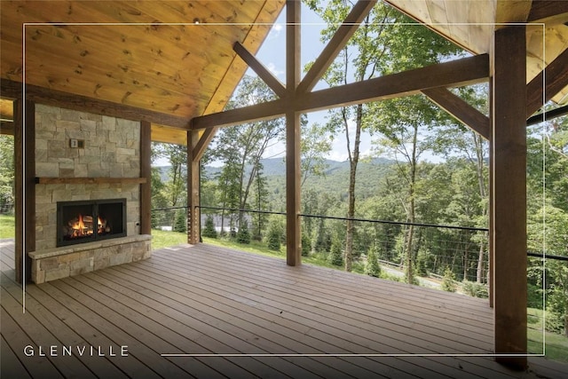 237 Glassy Rock Ln, Glenville, NC 28736 - wooden deck featuring a stone fireplace, a mountain view, and a forest view