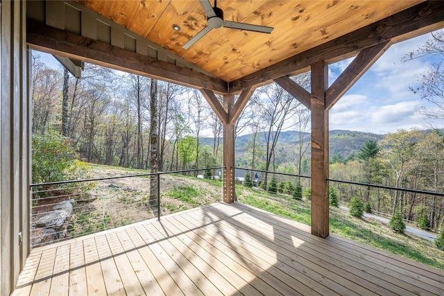 deck with a mountain view and ceiling fan