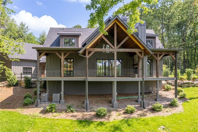 237 Glassy Rock Ln, Glenville, NC 28736 - back of house featuring board and batten siding, a shingled roof, and a chimney