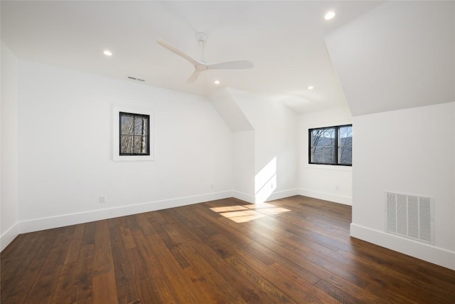 bonus room with dark wood-type flooring, ceiling fan, and vaulted ceiling