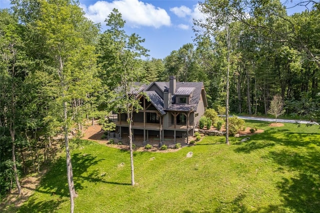 237 Glassy Rock Ln, Glenville, NC 28736 - rear view of house featuring a lawn, a view of trees, a chimney, and a wooden deck