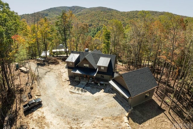 birds eye view of property featuring a mountain view